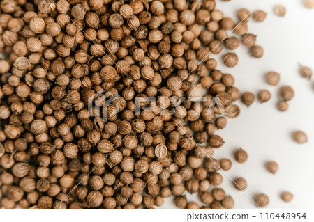Coriander seeds close up texture background 110448954