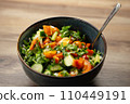 Close-up stirring with spoon ingredients vegetables in fresh delicious salad 110449191