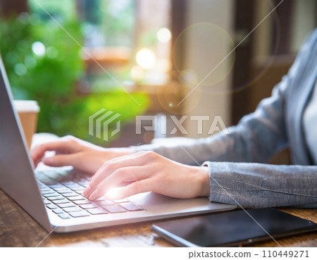 Woman using a computer, cafe, office, telework Woman using a computer, cafe, office, telework 110449271
