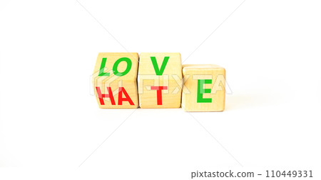 From hate to love symbol. Turned wooden cubes and changed the word hate to love. Beautiful white table, white background, copy space. Valentines day and hate or love concept. From hate to love symbol. Turned wooden cubes and changed the word hate to love. Beautiful white table, white background, copy space. Valentines day and hate or love concept. 110449331