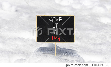 Give it a try symbol. Concept word Give it a try on beautiful black chalk blackboard. Beautiful white snow background. Business give it a try concept. Copy space. Give it a try symbol. Concept word Give it a try on beautiful black chalk blackboard. Beautiful white snow background. Business give it a try concept. Copy space. 110449386
