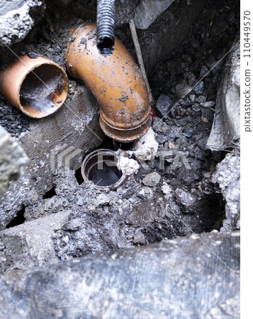 Broken pipes due to subsidence of building on a peatbog 110449570
