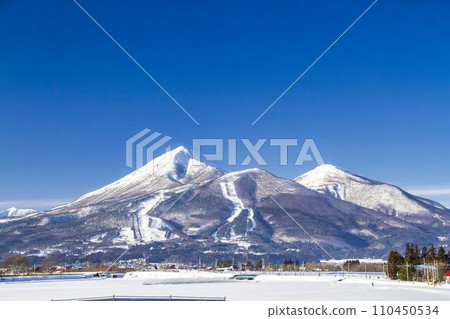 Blue sky and Mt. Bandai in winter, Inawashiro Town, Fukushima Prefecture 110450534