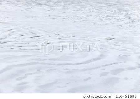 Ice and snow covering frozen river in winter season, background photo Ice and snow covering frozen river in winter season, background photo 110451693