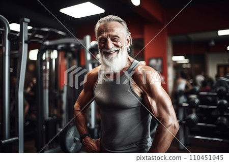 Elderly pensioner old man smiling in gym. 60-70 Year Old Bodybuilder. 110451945