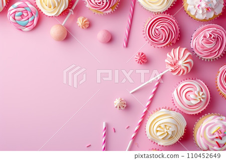 Pink table top on pink background with decorated lollipops and cupcakes, children birthday party Pink table top on pink background with decorated lollipops and cupcakes, children birthday party 110452649