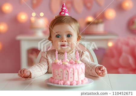 Baby girl birthday. Pink cake, balloons, one year. Cute girl on pink background 110452671
