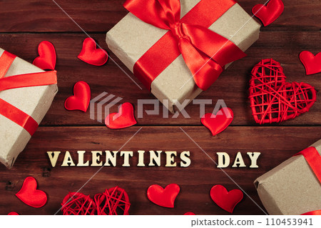 Valentine's day concept. Gifts in craft paper with red ribbons. 110453941