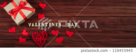 Valentine's day concept. Gifts in craft paper with red ribbons. Banner format Valentine's day concept. Gifts in craft paper with red ribbons. Banner format 110453943