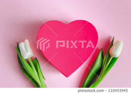 Valentine's day concept. Pink heart and white tulips. Greeting card, place for text. Valentine's day concept. Pink heart and white tulips. Greeting card, place for text. 110453945