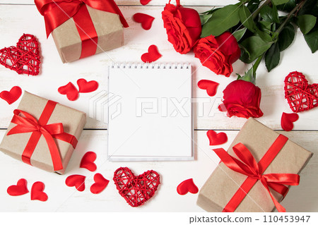 Valentine's day concept. Red roses, hearts and gift boxes on white background. Mockup, place for text. Valentine's day concept. Red roses, hearts and gift boxes on white background. Mockup, place for text. 110453947