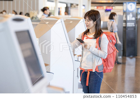 Airport check-in female backpacker Airport check-in female backpacker 110454853