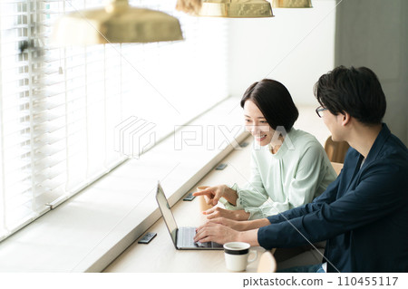 A man and a woman meeting at a cafe A man and a woman meeting at a cafe 110455117