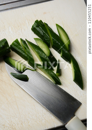 Knife and cut cucumber 110455251