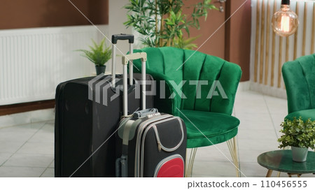 Interior of luxurious hospitality industry lobby at hotel, filled with plants and posh decorations. Empty cozy resort and reception front desk ready for arriving visitors, contemporary marble floors. Interior of luxurious hospitality industry lobby at hotel, filled with plants and posh decorations. Empty cozy resort and reception front desk ready for arriving visitors, contemporary marble floors. 110456555
