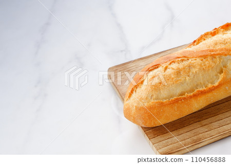 Freshly baked delicious baguette Freshly baked delicious baguette 110456888