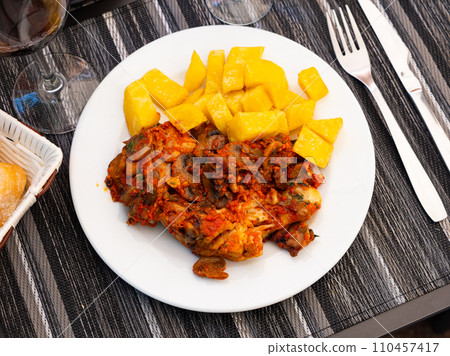 Chicken and mushroom served with french fries. Chicken and mushroom served with french fries. 110457417
