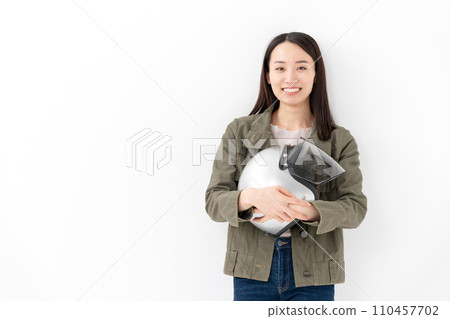 Woman holding a helmet Motorcycle girl Woman holding a helmet Motorcycle girl 110457702