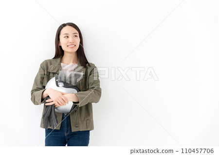 Woman holding a helmet Motorcycle girl 110457706