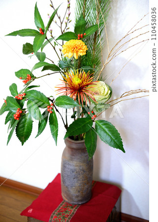 New Year's flowers such as pine, chrysanthemum, and senryo displayed in a vase New Year's flowers such as pine, chrysanthemum, and senryo displayed in a vase 110458036