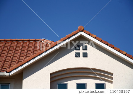 blue sky and red roof building 110458197