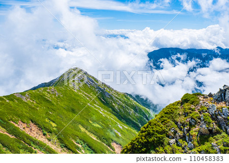 Climbing Mt. Jonendake in summer (view towards Mt. Jonendake from the summit of Mt. Jonendake) 110458383
