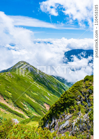 Climbing Mt. Jonendake in summer (view towards Mt. Jonendake from the summit of Mt. Jonendake) 110458385