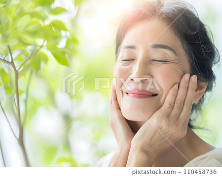 Asian grandmother with a natural smile and glowing healthy skin 110458736