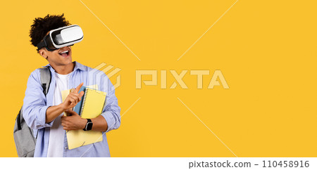 Delighted student with VR headset and books on yellow, copy space Delighted student with VR headset and books on yellow, copy space 110458916