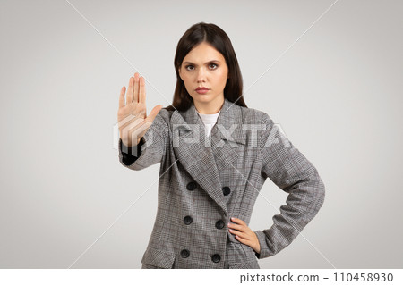 Stern woman showing stop sign with hand 110458930