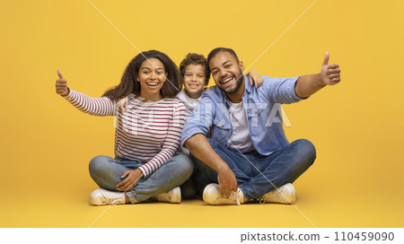 Like Concept. Happy African American Family Of Three Showing Thumbs Up Like Concept. Happy African American Family Of Three Showing Thumbs Up 110459090