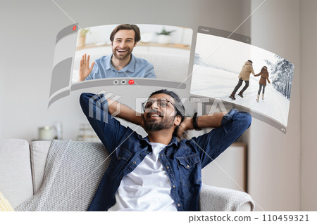 VR glasses transport young man into an digital world, redefining the way he connects with friends via digital screen VR glasses transport young man into an digital world, redefining the way he connects with friends via digital screen 110459321