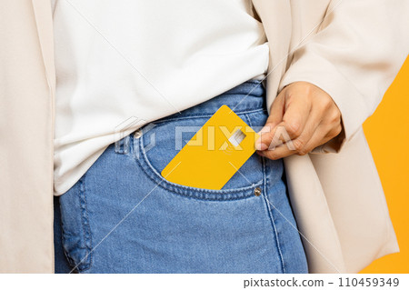 Hand of young asian lady puts credit card it in pocket, enjoy shopping 110459349