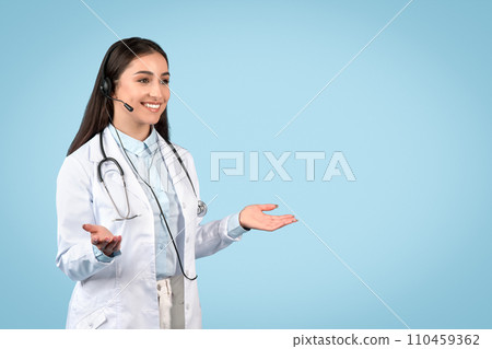 Woman doctor with headset ready for teleconsultation 110459362