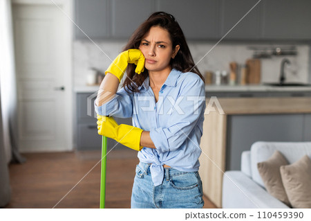 Tired woman with mop taking break from cleaning 110459390