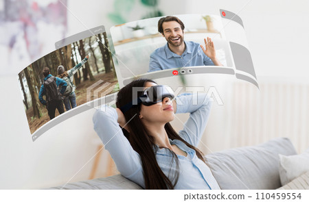 Young relaxed woman seamlessly blends virtual reality with video chats, creating memorable moments at home 110459554
