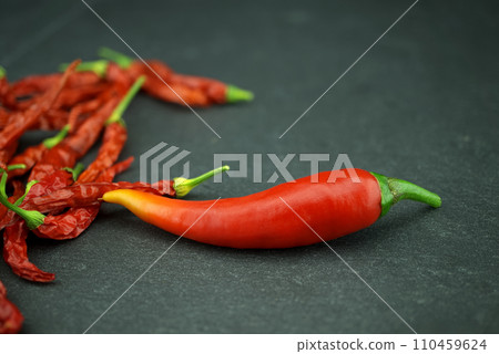 Fresh and dried whole red hot chili peppers Fresh and dried whole red hot chili peppers 110459624