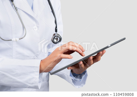 Millennial caucasian lady professional doctor use tablet, chatting on light background Millennial caucasian lady professional doctor use tablet, chatting on light background 110459808