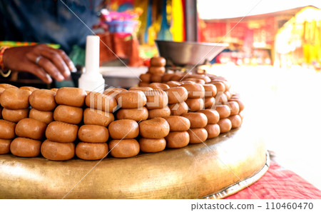 Indian Sweet shop display peda or pera outside of temple Indian Sweet shop display peda or pera outside of temple 110460470