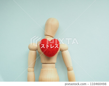 Red heart and stress text on mannequin chest, copy space 110460498