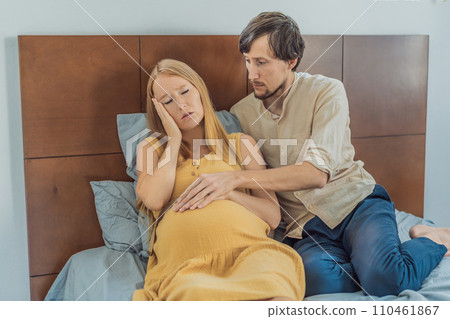 Expectant woman feels unwell, husband comforts and reassures her during a challenging pregnancy Expectant woman feels unwell, husband comforts and reassures her during a challenging pregnancy 110461867
