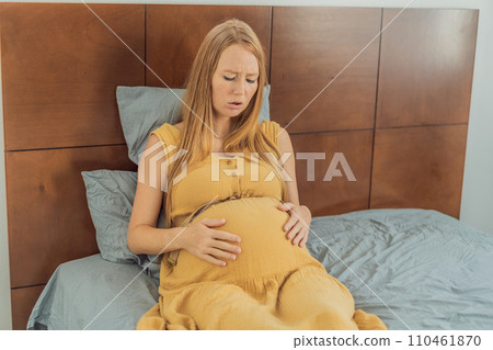 Expectant woman experiences discomfort, feeling unwell during pregnancy Expectant woman experiences discomfort, feeling unwell during pregnancy 110461870