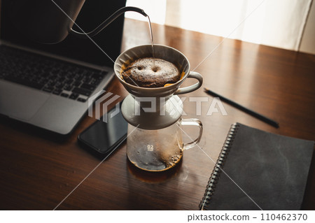 Drip coffee on your work desk in the morning 110462370