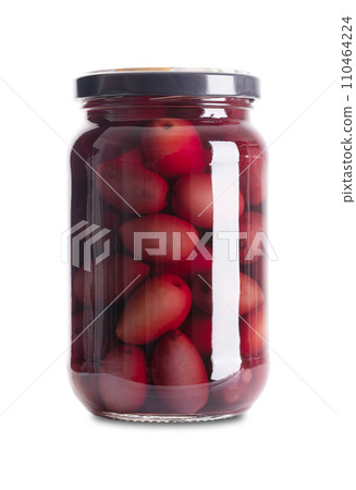 Kalamata olives, pickled whole, large and dark purple table olives, in a glass jar with screw cap. Olive variety from Kalamata region in Greece. Hand-picked ripe fruits with pit, preserved in a brine. 110464224
