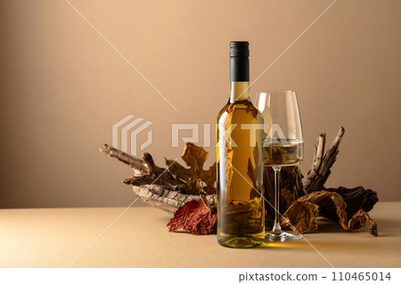 White wine and snags on a beige background. White wine and snags on a beige background. 110465014