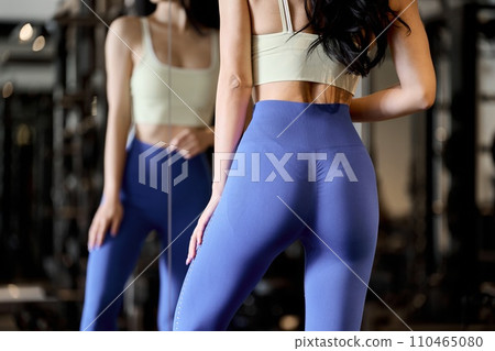 A woman doing butt training at the gym A woman doing butt training at the gym 110465080