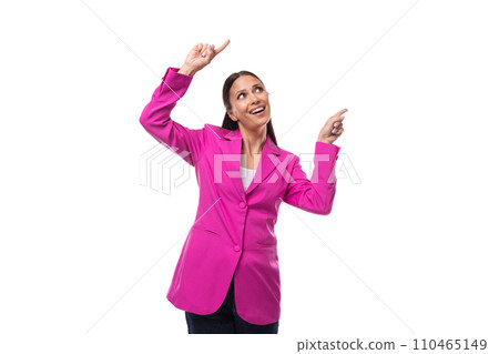 young charismatic well-groomed brunette business woman dressed in a pink chic suit writes a message 110465149