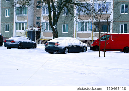 Cars covered with snow in the parking lot. Cars covered with snow in the parking lot. 110465418
