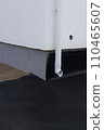 Black waterproofing membrane around the foundation of the house. Construction of the blind area of the house. Reliable protection of the foundation from moisture. 110465607
