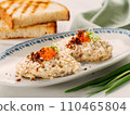 Fish appetizer forshmak - minced meat from herring fish, decorated caviar on plate. Traditional Jewish cuisine dish vorschmack forshmak made of herring fillet as independent dish on wooden background 110465804